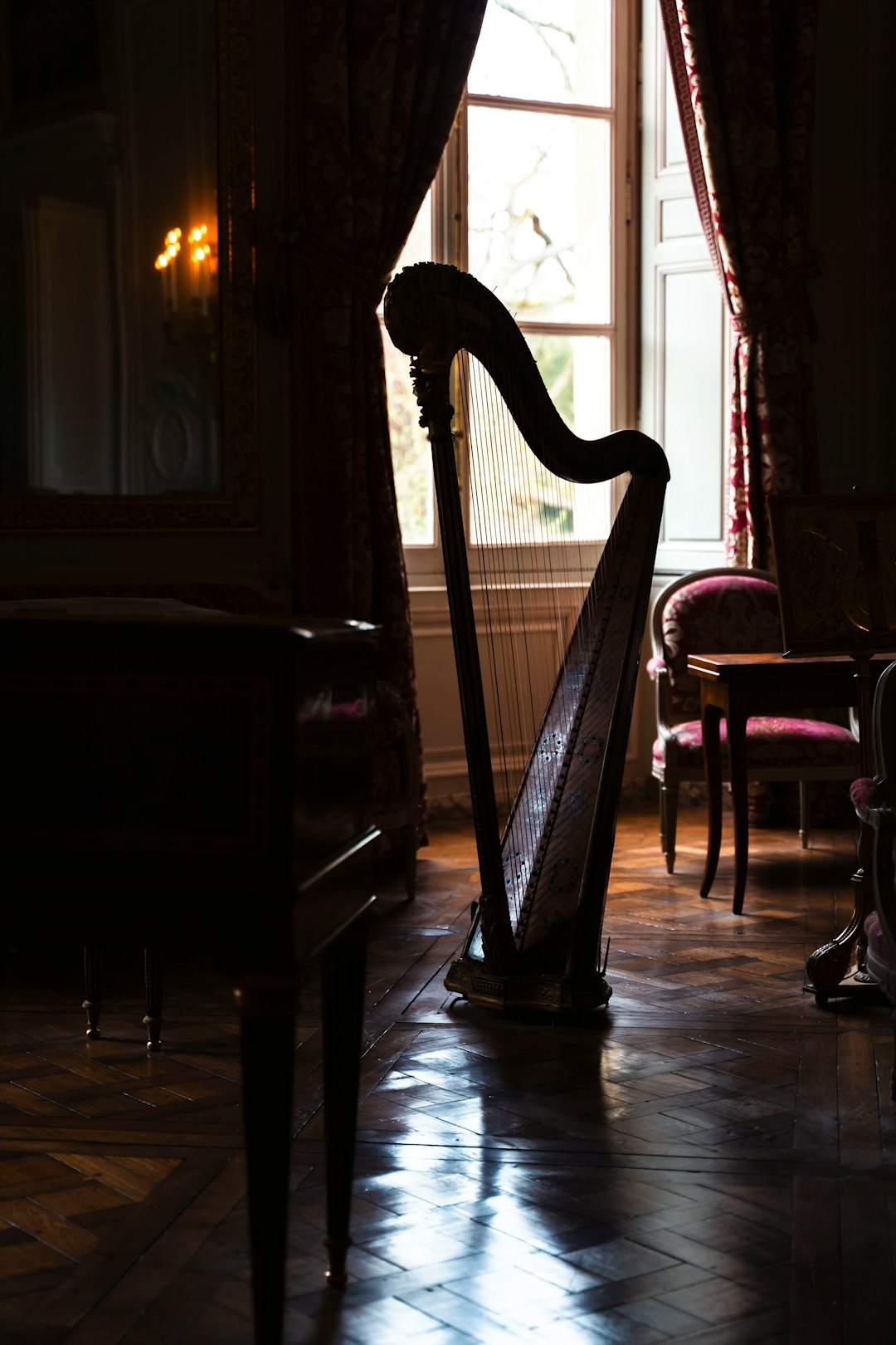 hero-img-02 a-harp-sitting-in-a-room-next-to-a-window-cgiurtvm0wo